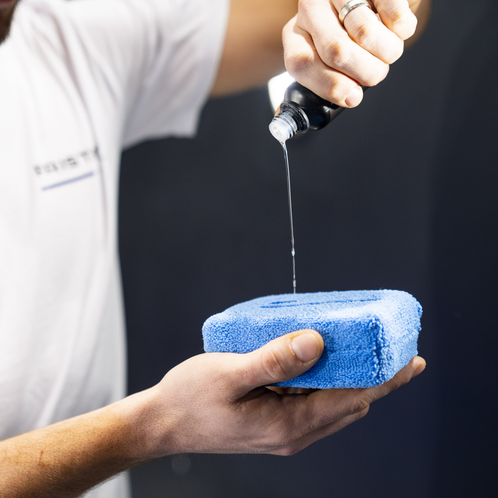 Ceramic coating being applied to an applicator pad